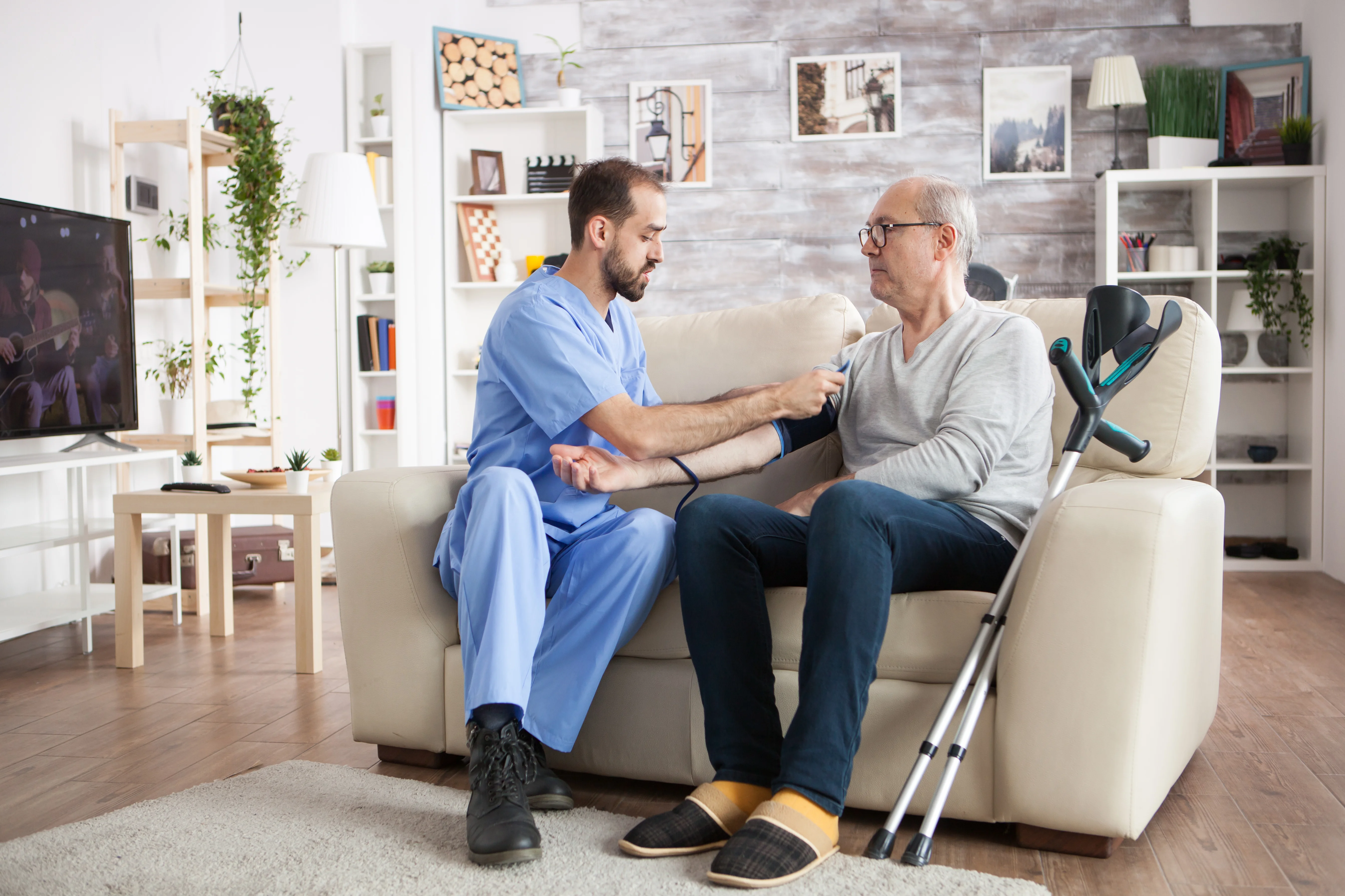 Elderly person with caregiver in home setting